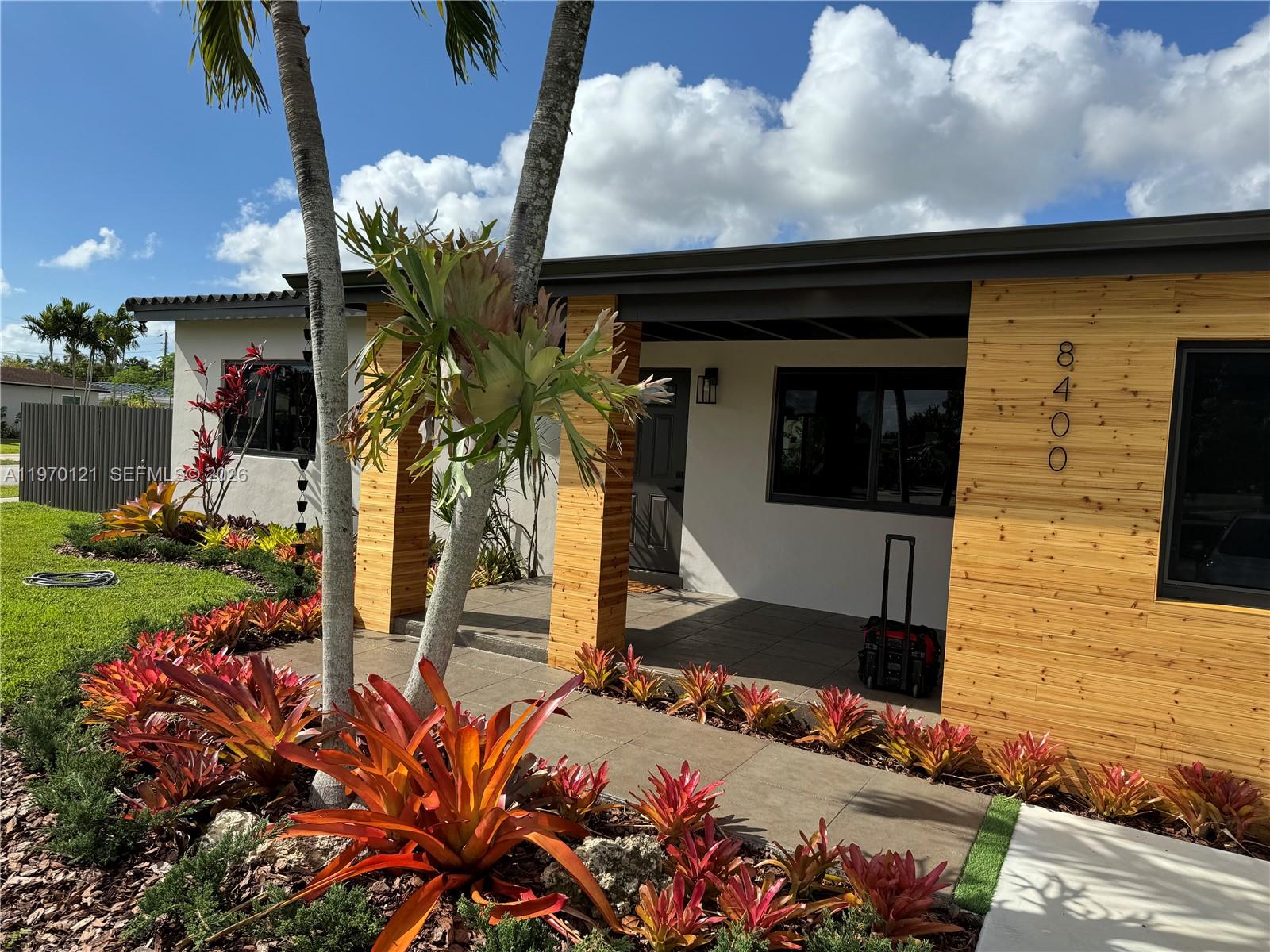 8400 Southwest 46th Street Miami, FL 33155 - Photo 1 of 12 a potted plant sitting in front of a house