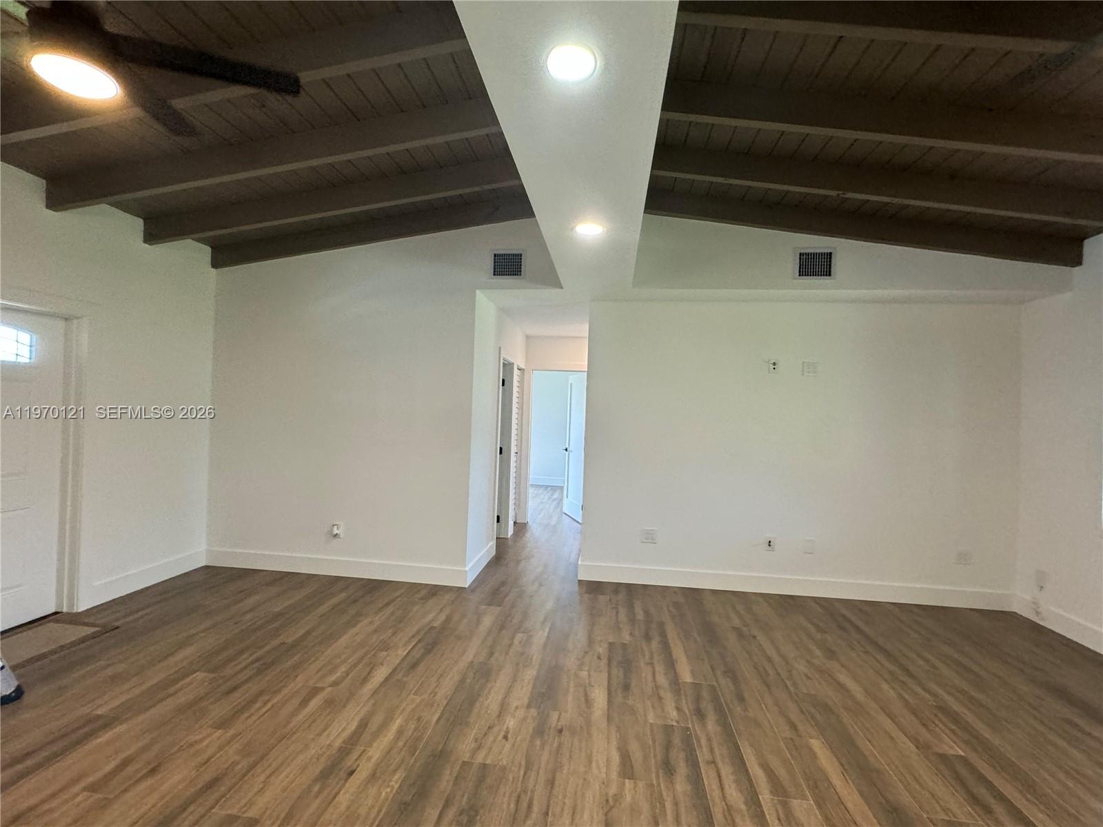 8400 Southwest 46th Street Miami, FL 33155 - Photo 11 of 12 an empty room with wooden floor and windows