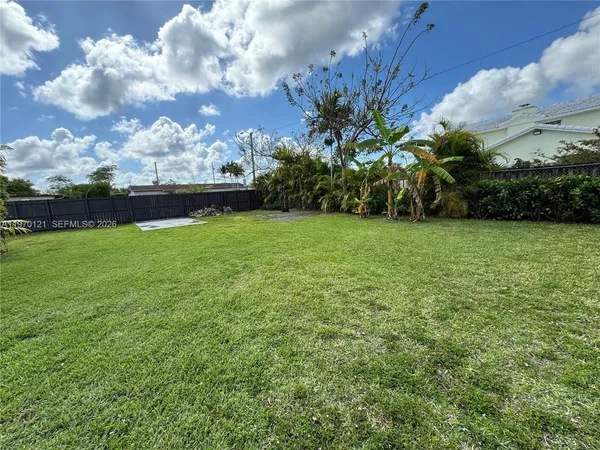 a view of a garden with a building