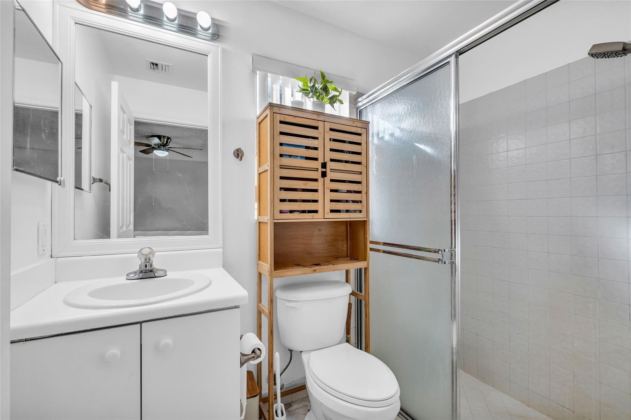 1665 Zenith Way Weston, FL 33327 - Photo 15 of 22 a bathroom with a sink a toilet and shower
