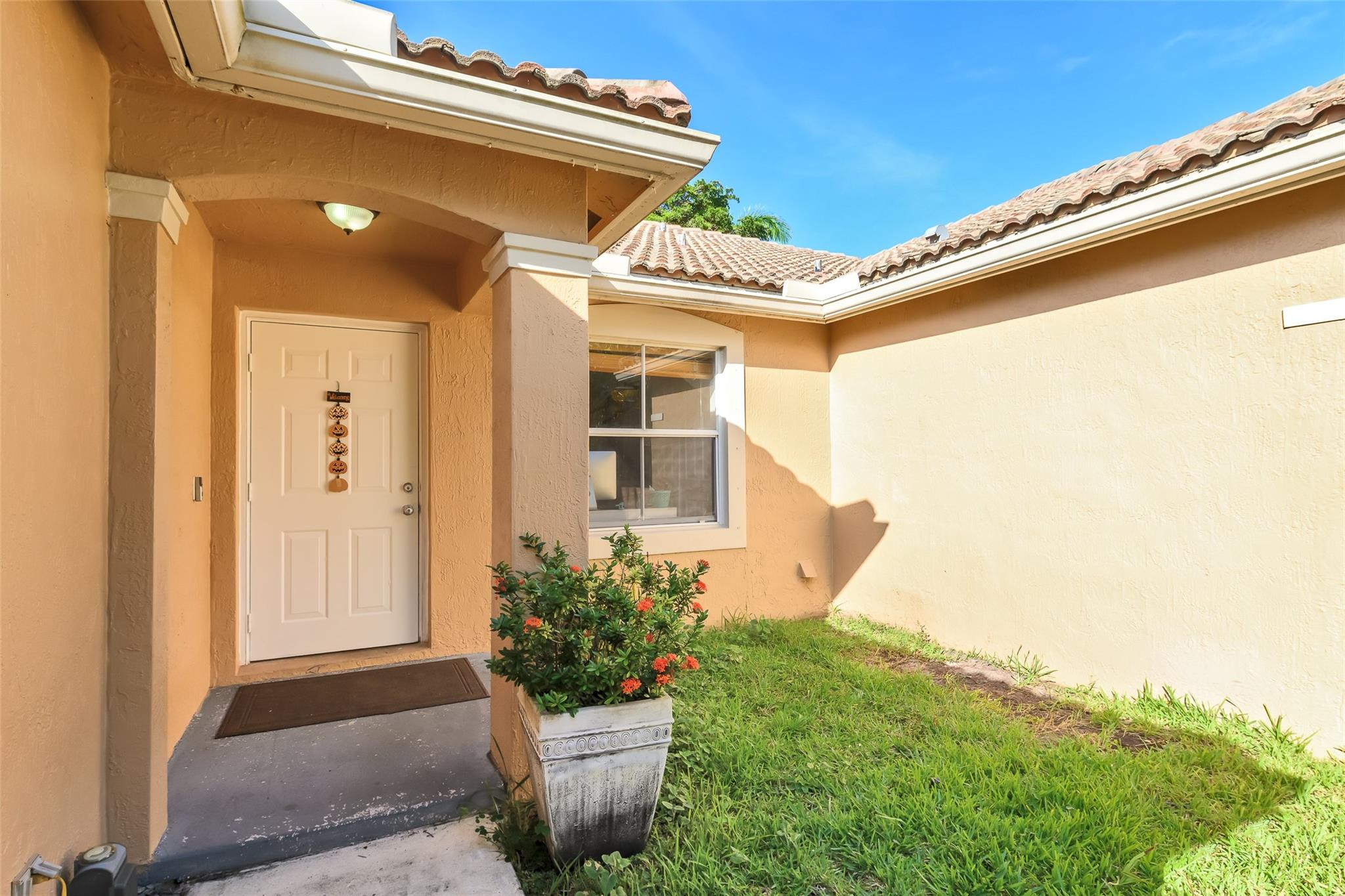 1665 Zenith Way Weston, FL 33327 - Photo 2 of 22 a front view of a house with plants