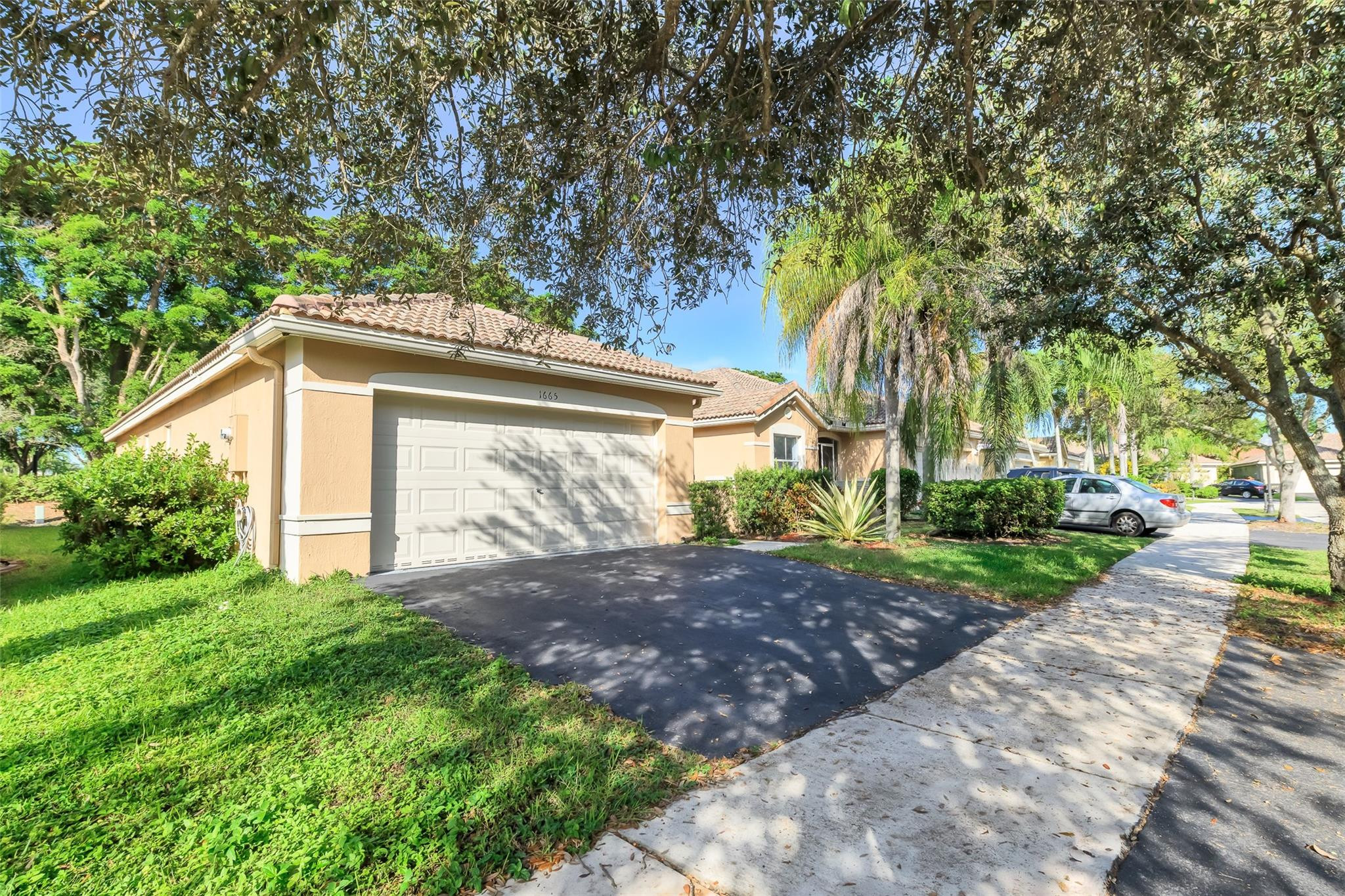 1665 Zenith Way Weston, FL 33327 - Photo 21 of 22 a view of a house with a tree