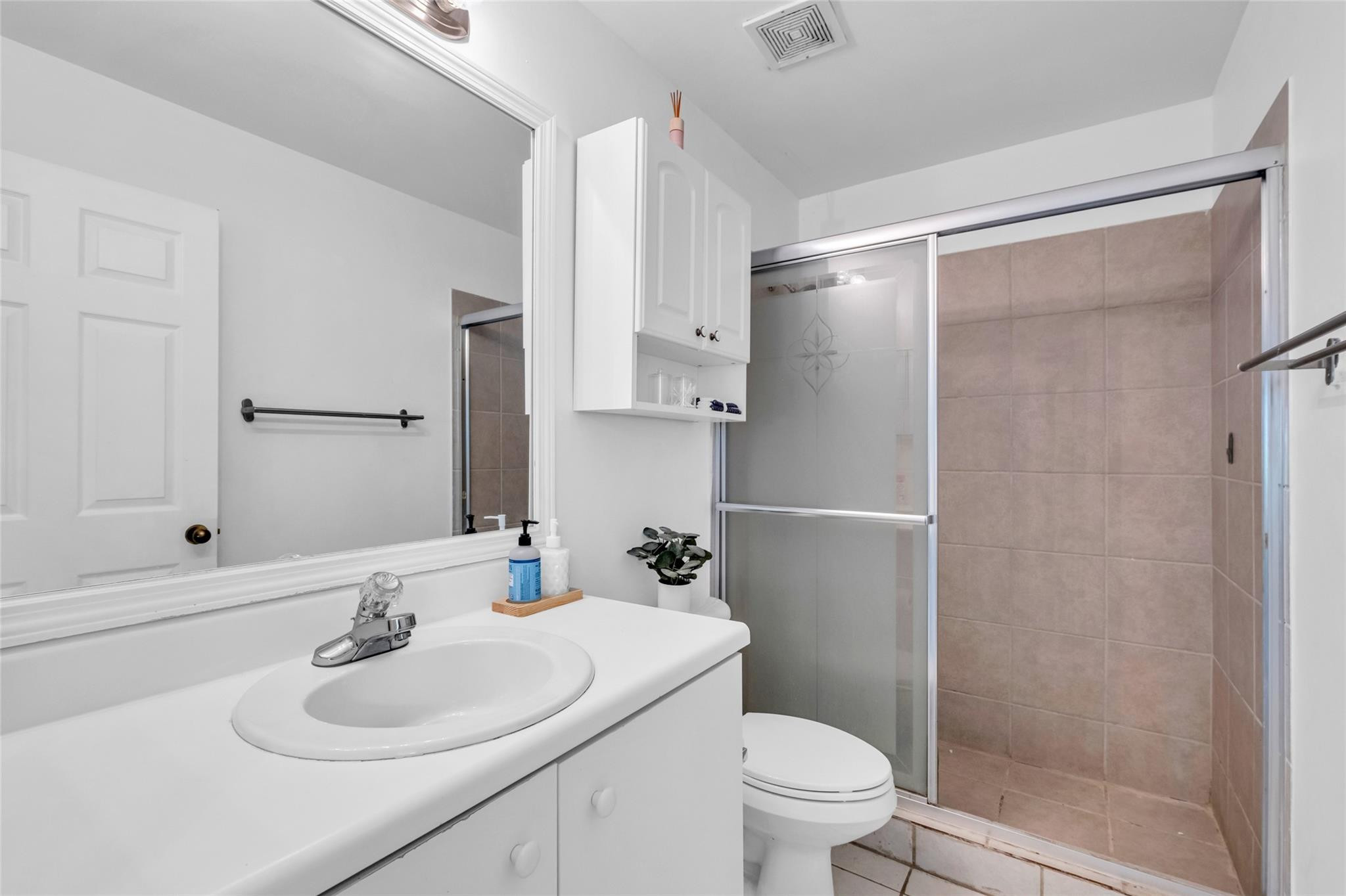 1665 Zenith Way Weston, FL 33327 - Photo 7 of 22 a bathroom with a sink toilet and shower