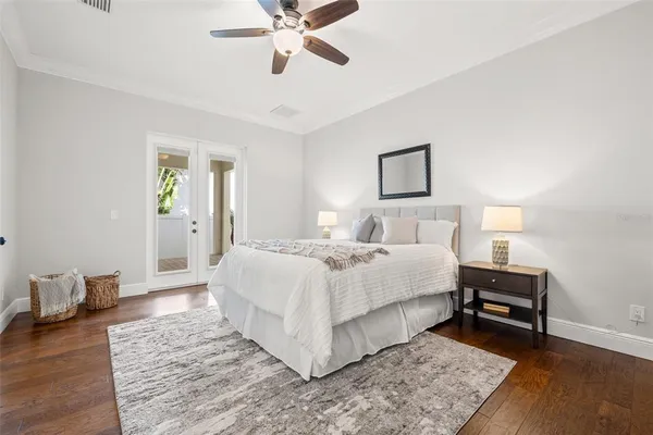 a bedroom with a bed and a lamp