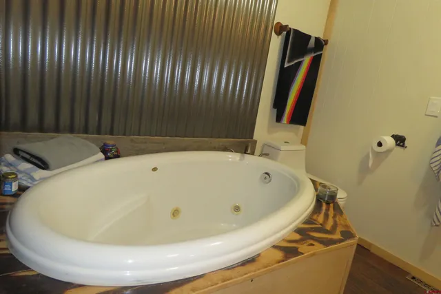 a white bath tub sitting in a bathroom