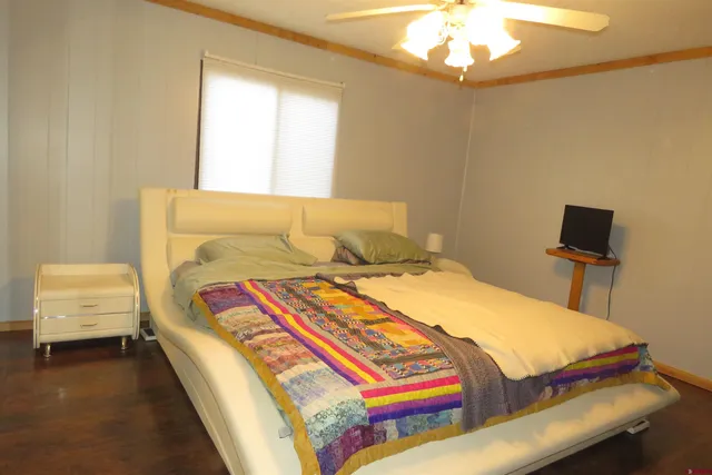 a bedroom with a bed and a couch