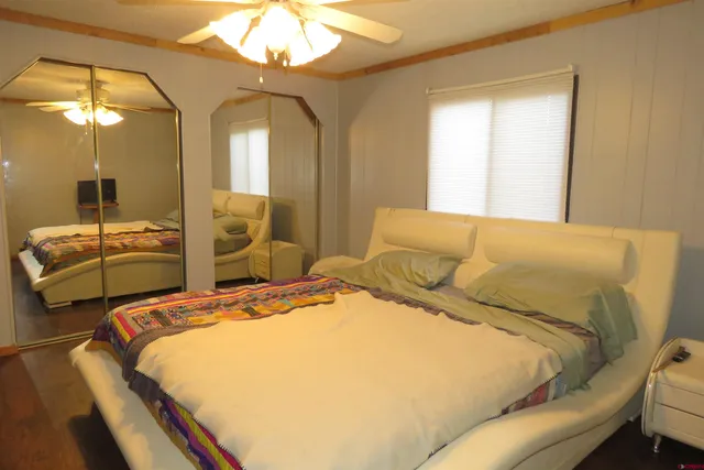 a bedroom with bed and window