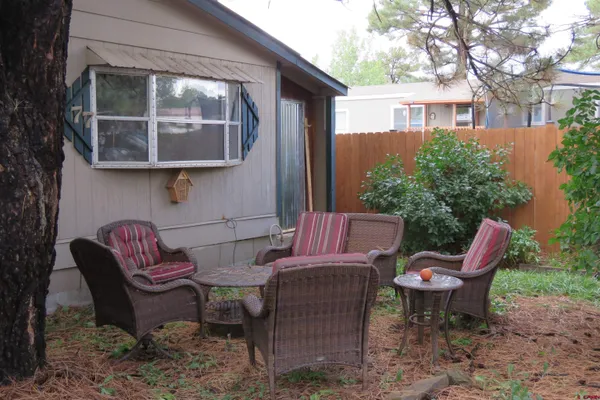 a view of a patio in the backyard