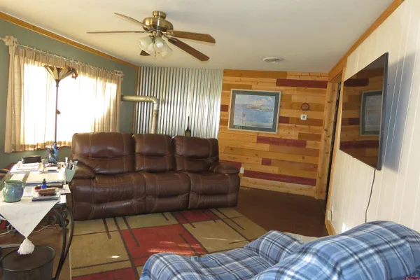 a living room with a couch and a chandelier