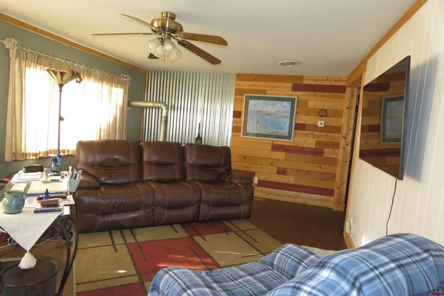 a living room with a couch and a chandelier