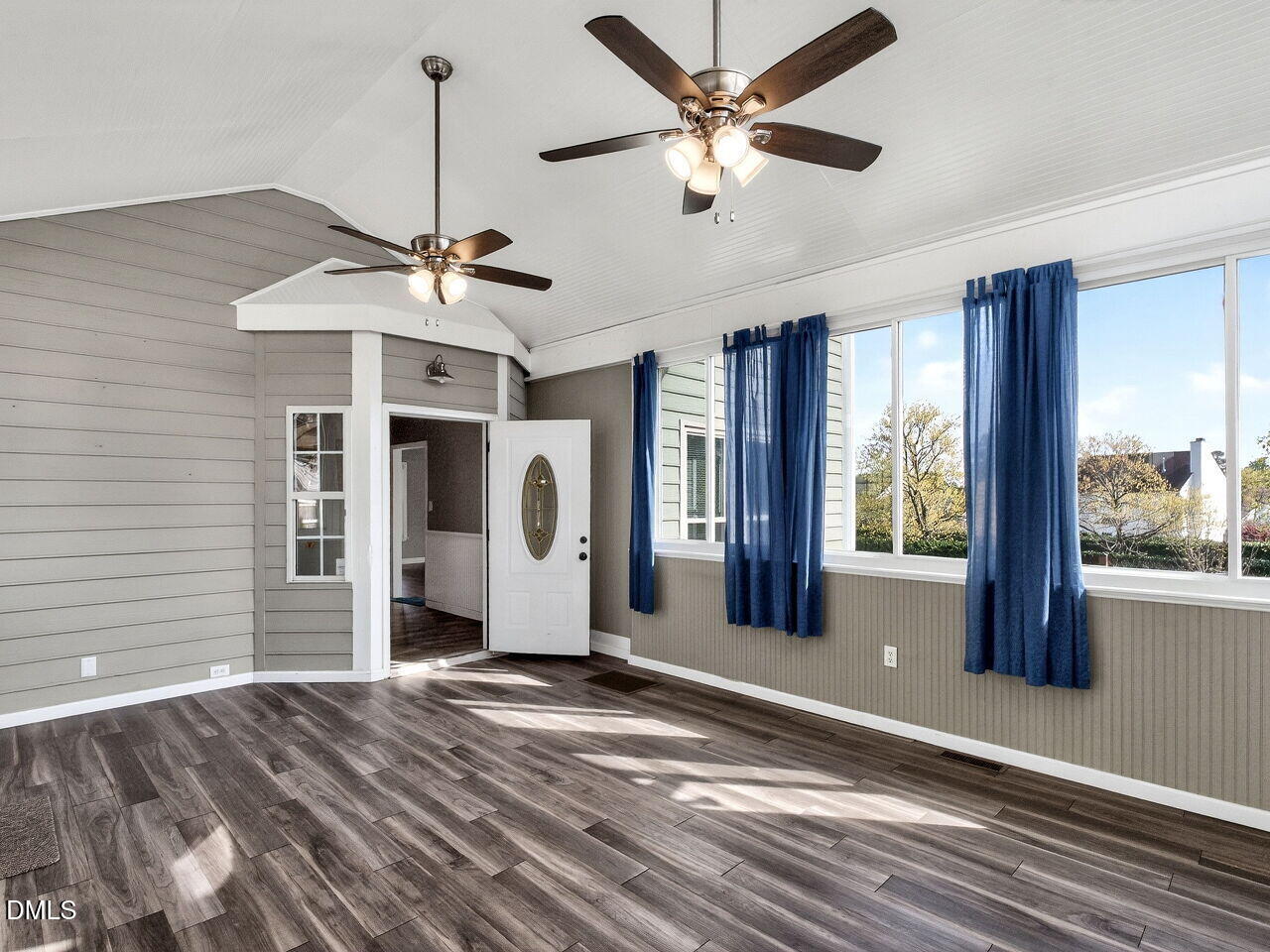 4500 Rivershyre Way Raleigh, NC 27616 - Photo 19 of 42 a view of a livingroom with a chandelier fan and windows
