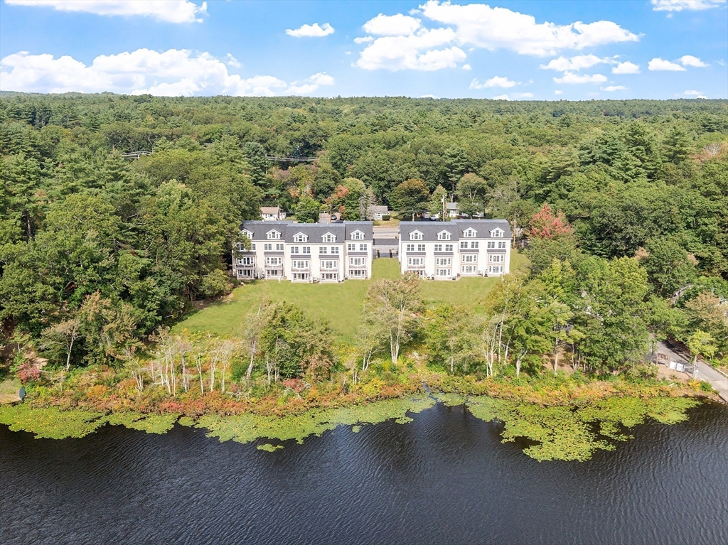 206 West Main Street, Unit 9 Georgetown, MA 01833 - Photo 1 of 25 a view of a lake from a yard