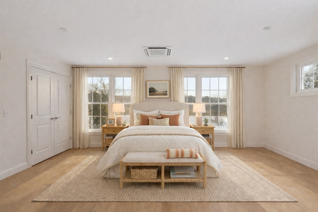 206 West Main Street, Unit 9 Georgetown, MA 01833 - Photo 11 of 25 a bed room with a bed and a large window