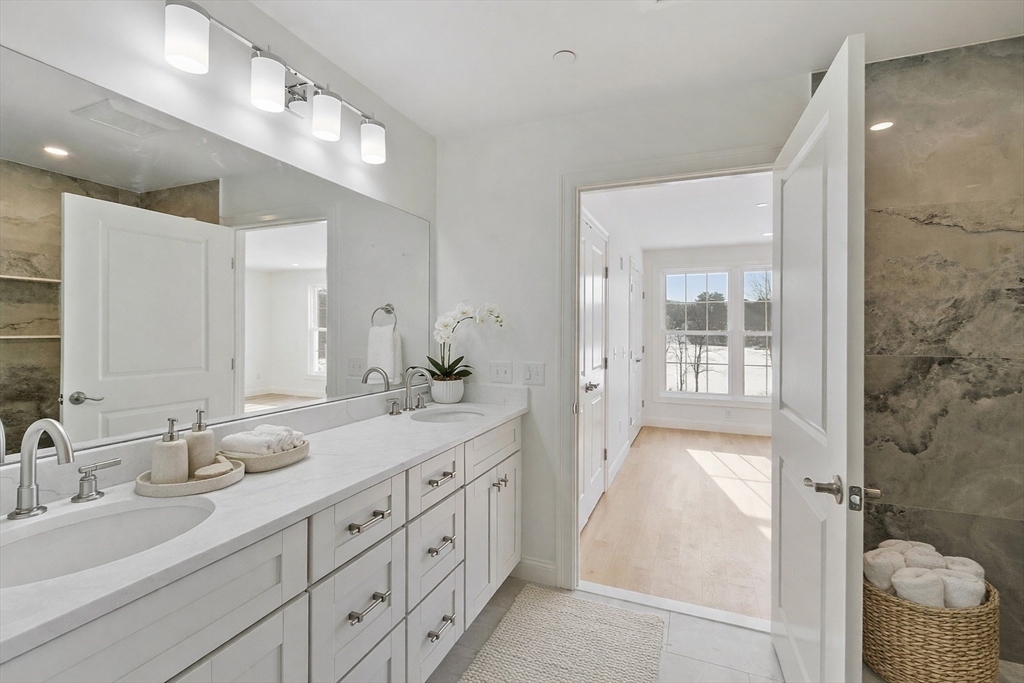 206 West Main Street, Unit 9 Georgetown, MA 01833 - Photo 12 of 25 a spacious bathroom with double sink and a mirror
