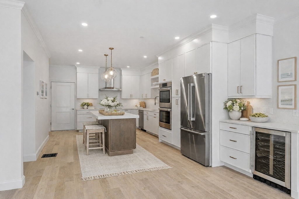 206 West Main Street, Unit 9 Georgetown, MA 01833 - Photo 7 of 25 a kitchen with a refrigerator and a sink