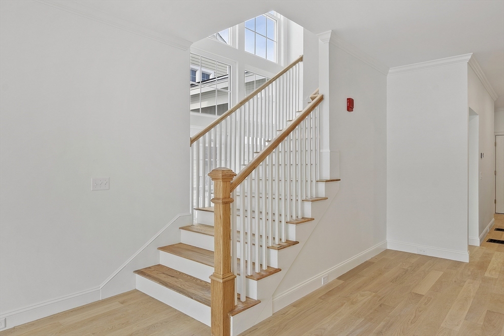 206 West Main Street, Unit 9 Georgetown, MA 01833 - Photo 9 of 25 a view of entryway and hall with wooden floor