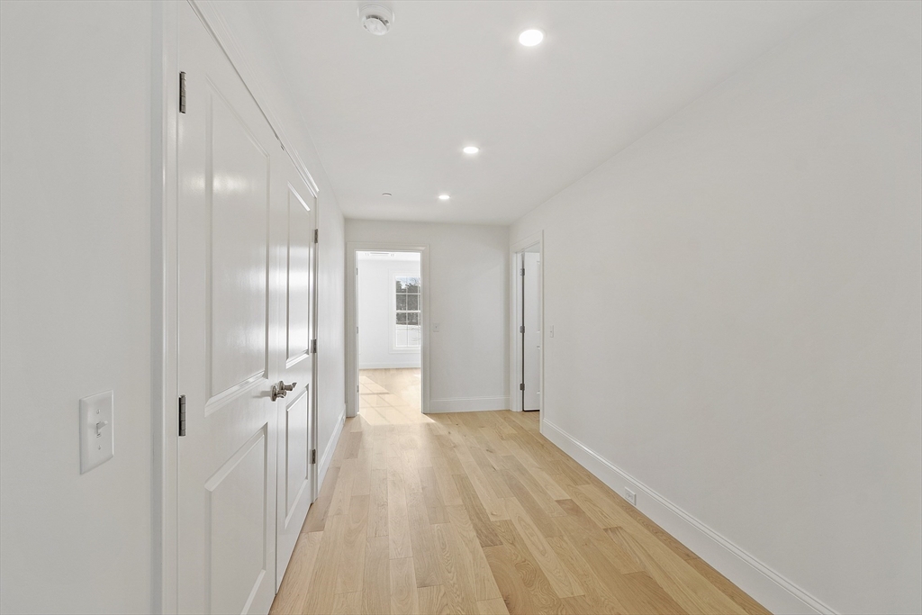 206 West Main Street, Unit 9 Georgetown, MA 01833 - Photo 10 of 25 a view of a hallway with wooden floor