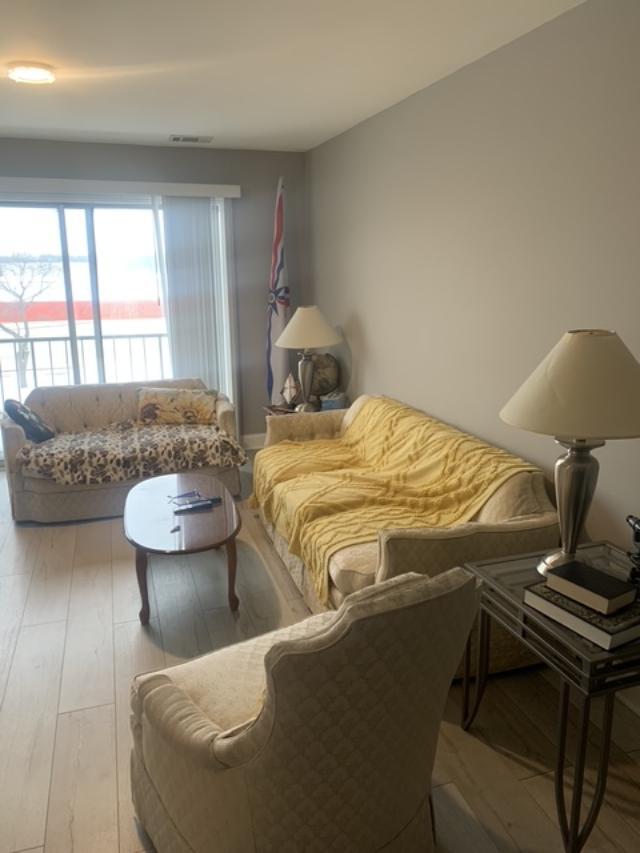 8620 Waukegan Road, Unit 308 Morton Grove, IL 60053 - Photo 3 of 10 a bedroom with a bed and window