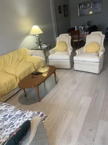 a bedroom with two beds and lamp