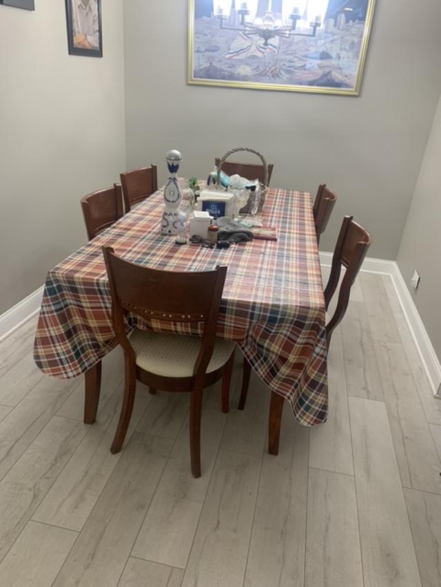 8620 Waukegan Road, Unit 308 Morton Grove, IL 60053 - Photo 6 of 10 a view of a dining room with furniture