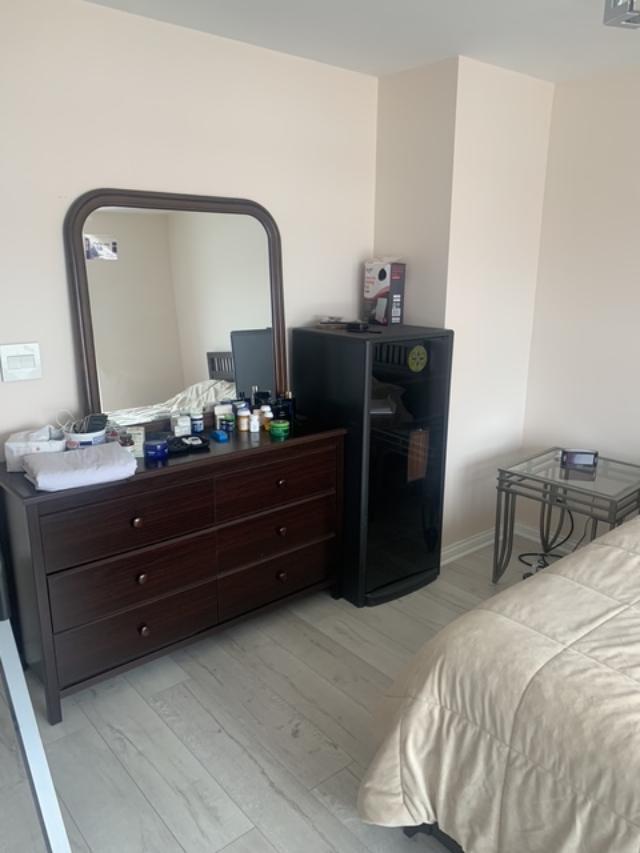 8620 Waukegan Road, Unit 308 Morton Grove, IL 60053 - Photo 9 of 10 a bedroom with a bed and with mirror