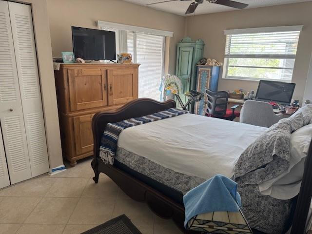 522 Flanders P, Unit 522 Delray Beach, FL 33484 - Photo 10 of 11 a bedroom with a bed and furniture