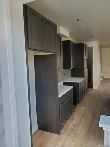a kitchen with stainless steel appliances a sink stove and refrigerator