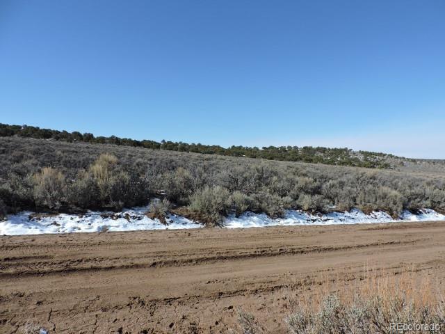 3483 Bixby Road Fort Garland, CO 81133 - Photo 8 of 12 a view of dirt field and mountains