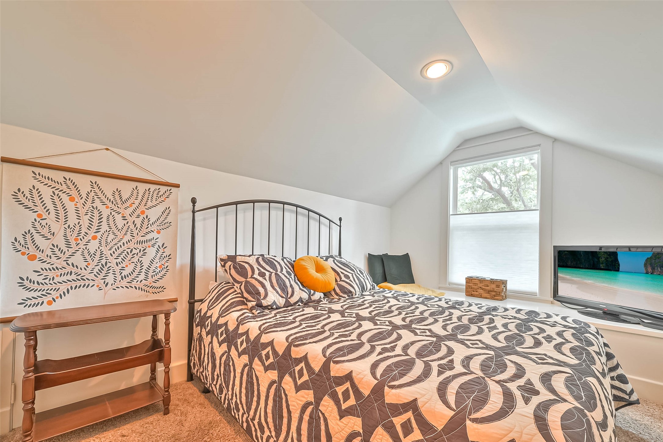 412 Sue Street Houston, TX 77009 - Photo 14 of 19 Second upstairs bedroom with a charming sloped ceiling and built in window seat for quiet relaxing.