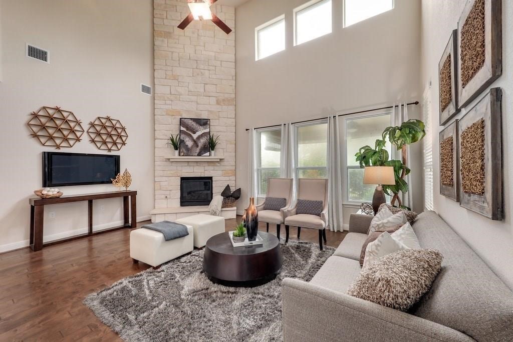 10825 Ballard Path Austin, TX 78717 - Photo 6 of 39 a living room with furniture a fireplace and a flat screen tv