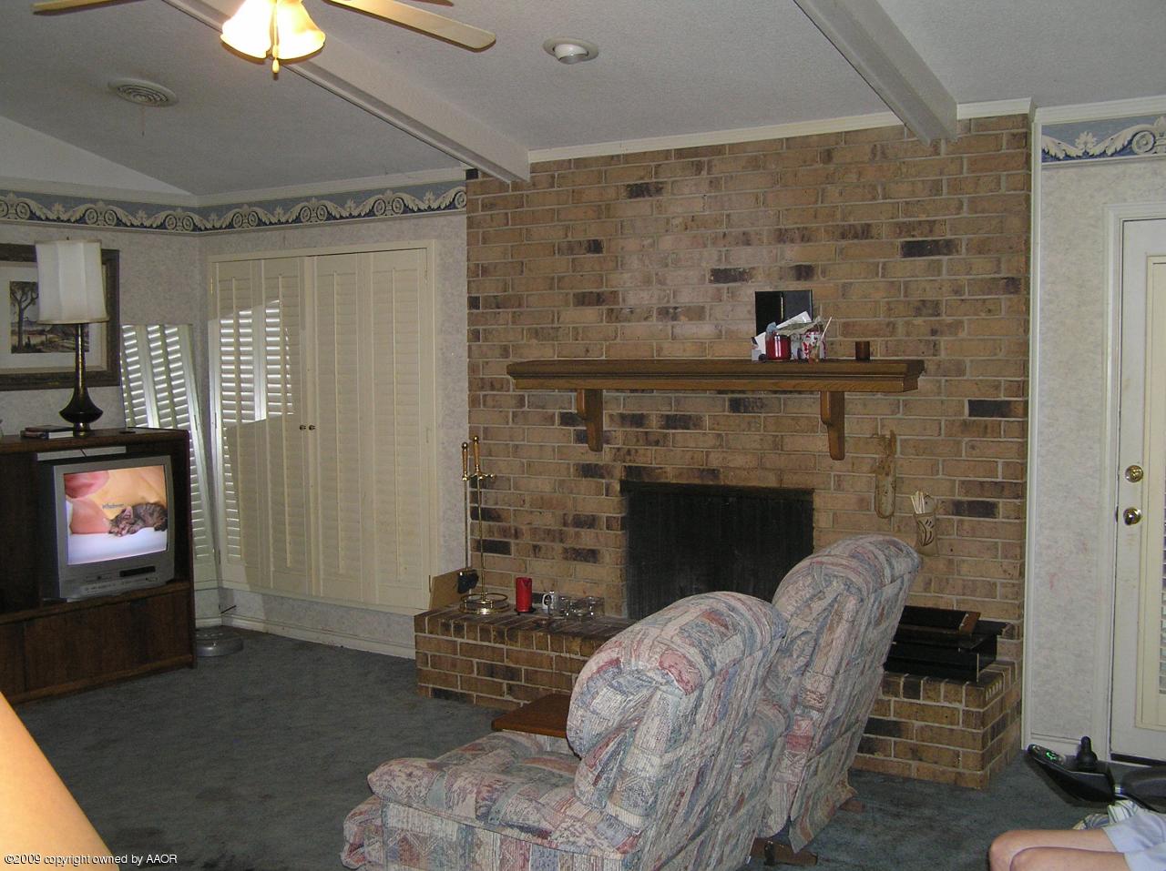 6020 Jameson Road Amarillo, TX 79106 - Photo 8 of 10 a living room with furniture and a fireplace