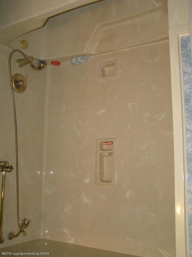 6020 Jameson Road Amarillo, TX 79106 - Photo 9 of 10 a bathroom with a shower