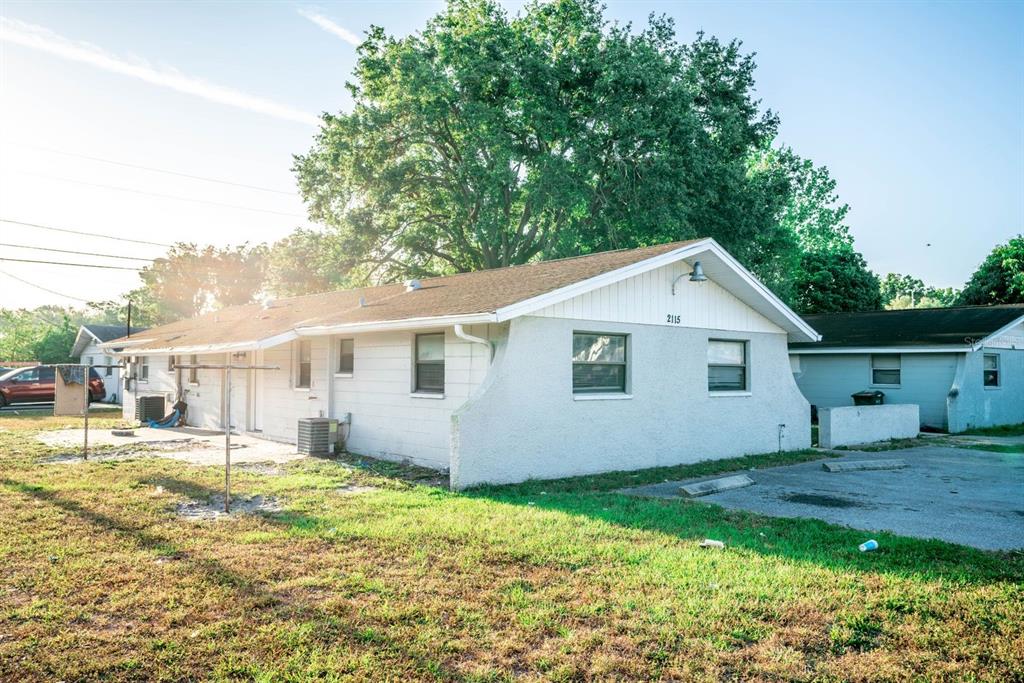2115 Coral Way, Unit A Largo, FL 33771 - Photo 1 of 1 a view of a backyard with plants and large tree