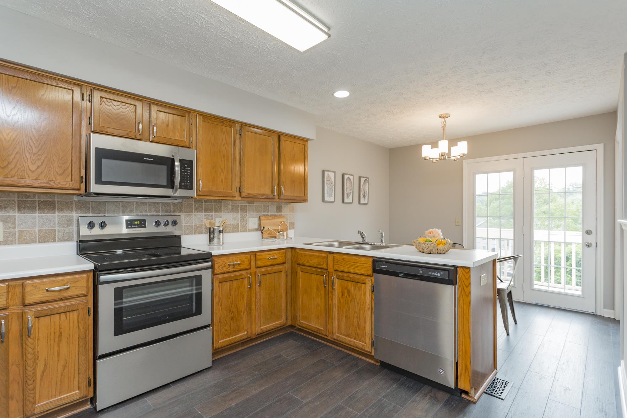 Kitchen cabinets and bath room vanities are refinished, real wood, Aristokraft cabinets with brushed nickel accents.