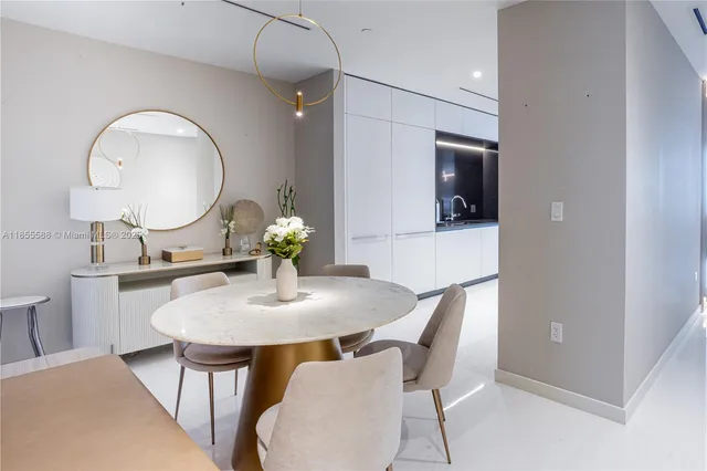 a dining room with furniture and a mirror