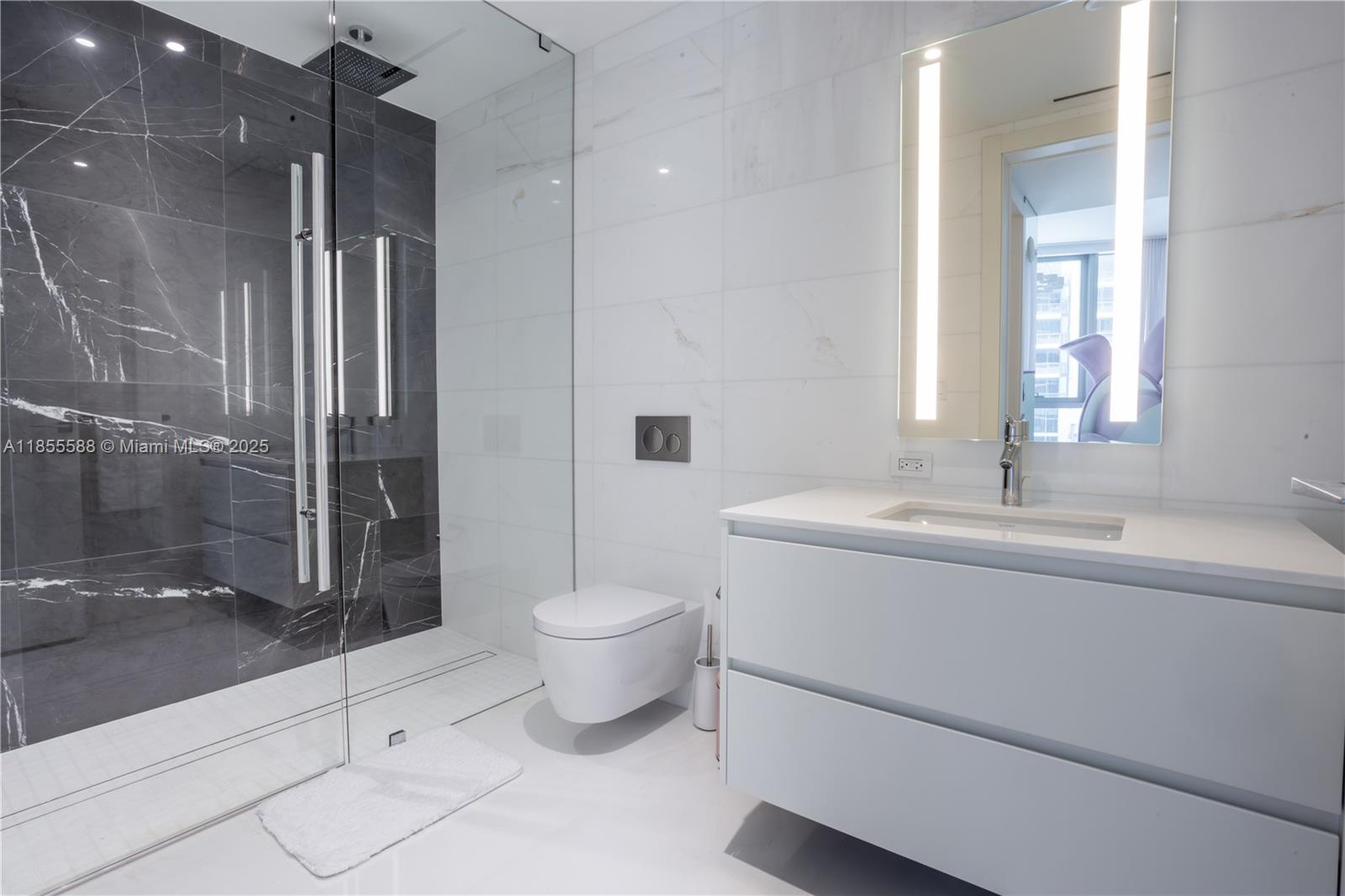 300 Biscayne Blvd Way, Unit 2203C Miami, FL 33131 - Photo 20 of 30 a bathroom with a sink toilet and shower