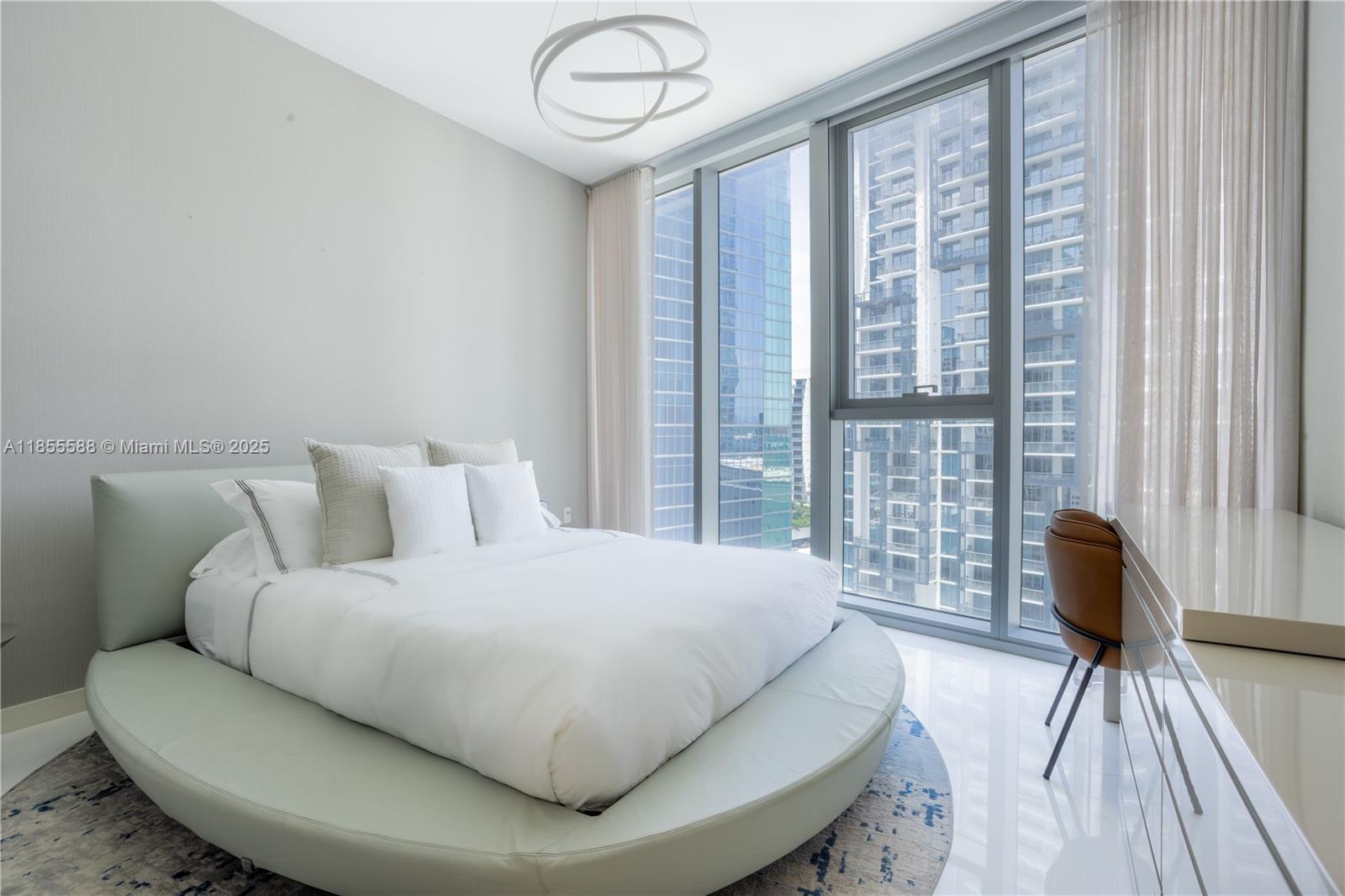 300 Biscayne Blvd Way, Unit 2203C Miami, FL 33131 - Photo 24 of 30 a bedroom with a bed and a large window