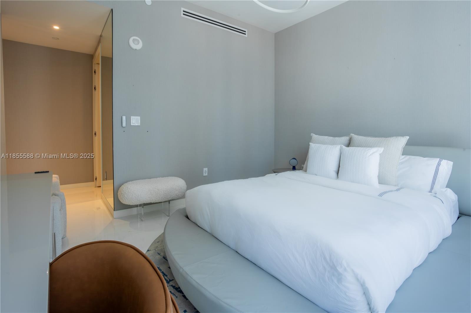 300 Biscayne Blvd Way, Unit 2203C Miami, FL 33131 - Photo 25 of 30 a bedroom with a bed and a couch