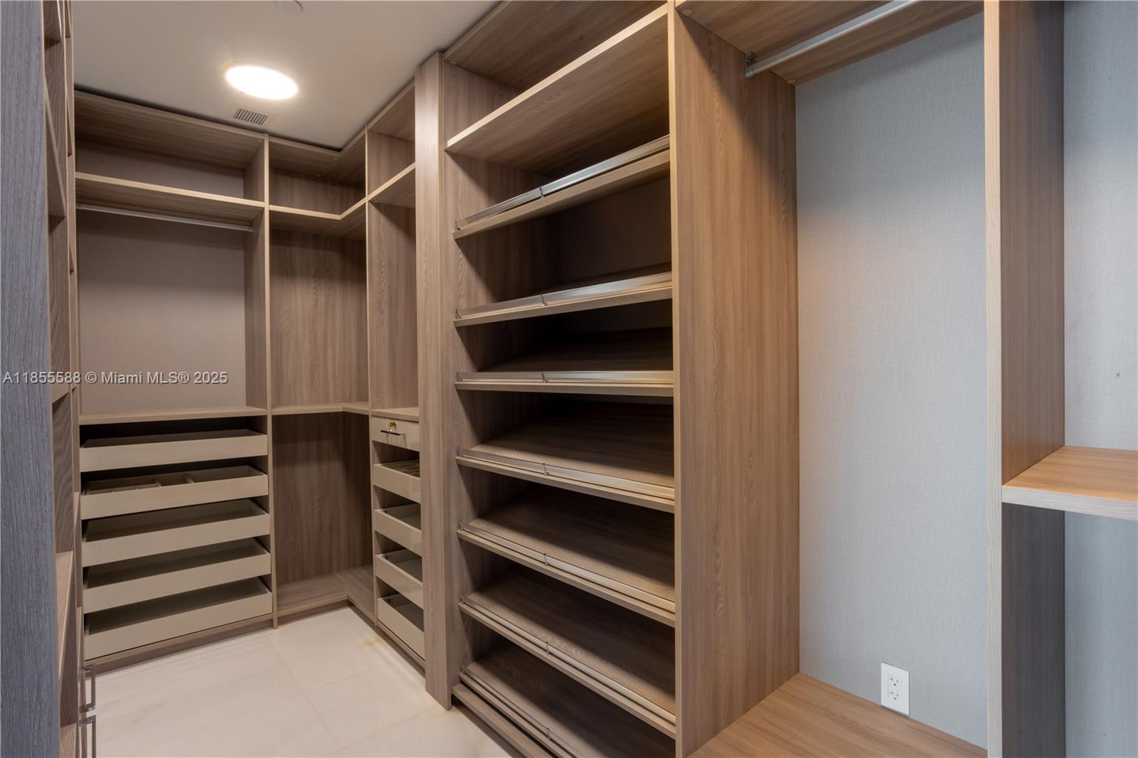 300 Biscayne Blvd Way, Unit 2203C Miami, FL 33131 - Photo 6 of 30 a view of walk in closet with empty racks