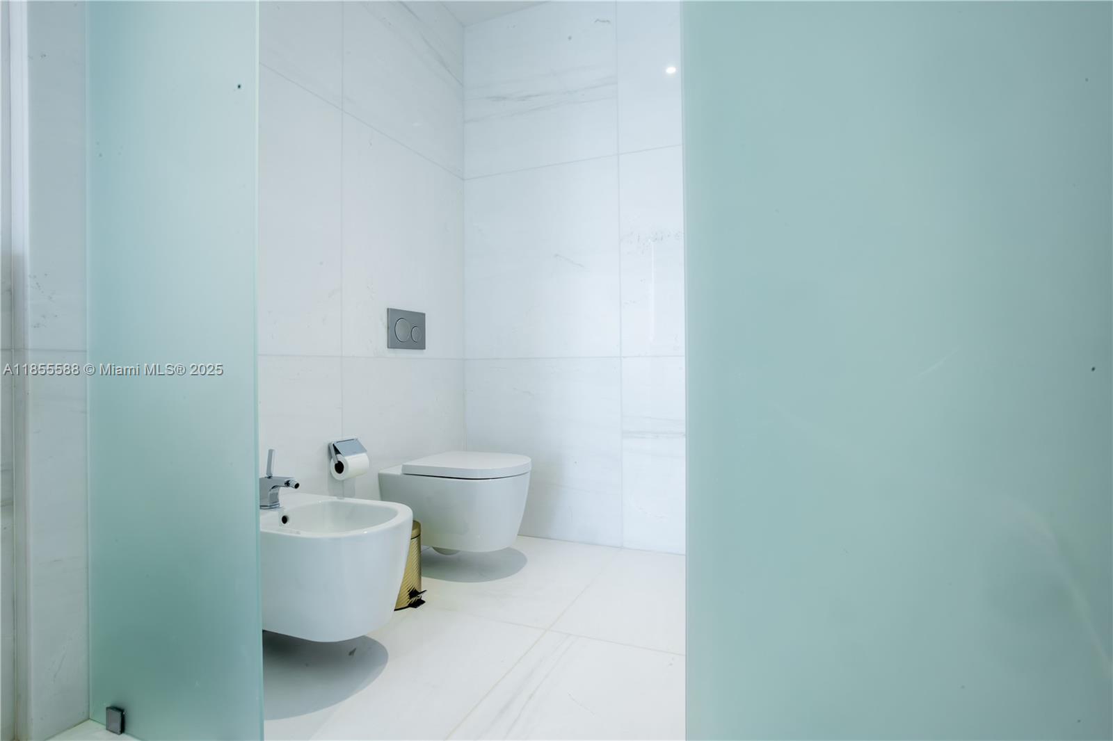 300 Biscayne Blvd Way, Unit 2203C Miami, FL 33131 - Photo 10 of 30 a white toilet sitting next to a white sink