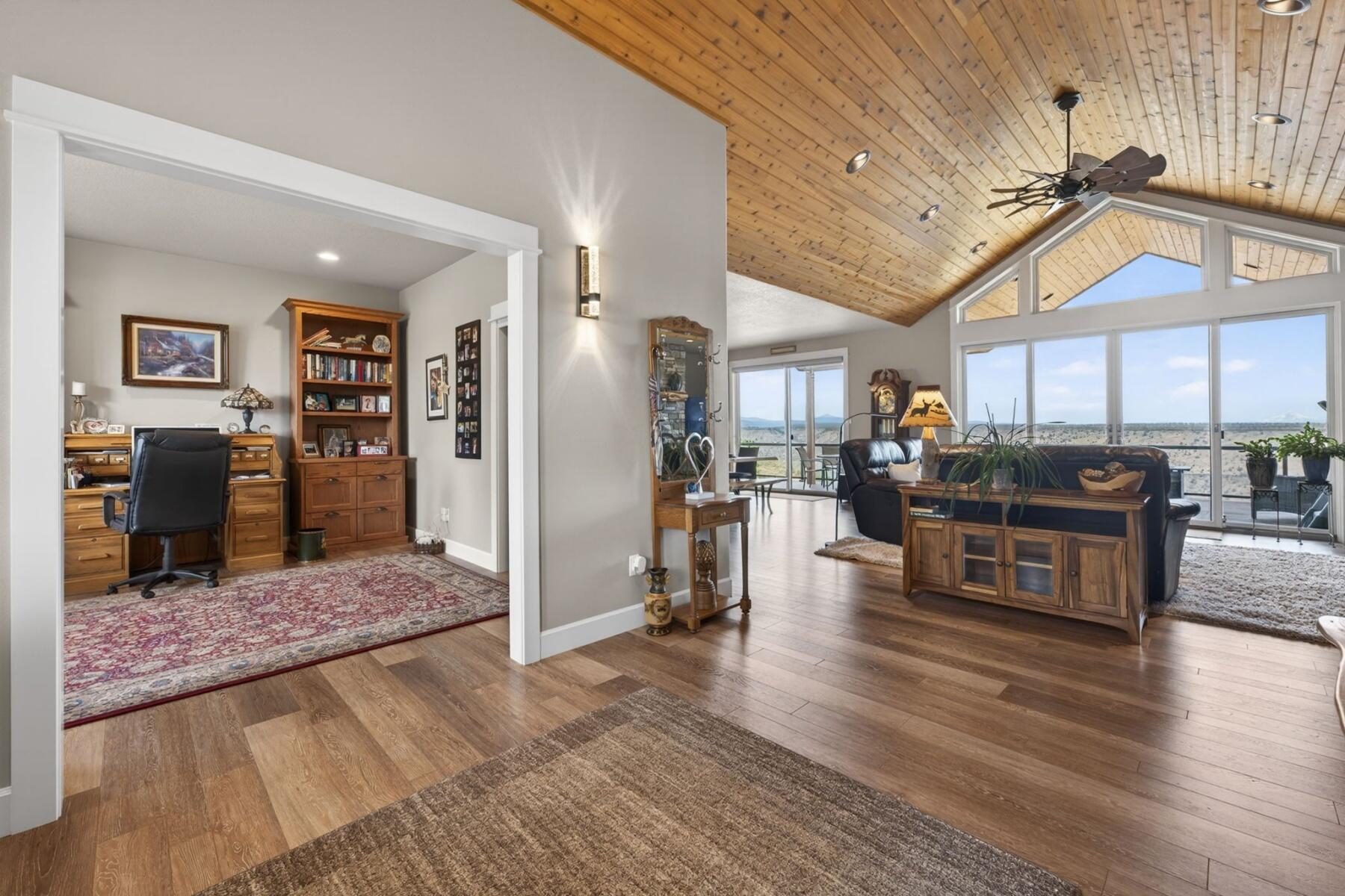 11620 Southwest Pixie Lane Culver, OR 97734 - Photo 6 of 53 a living room with stainless steel appliances kitchen island granite countertop furniture wooden floor and a view of kitchen