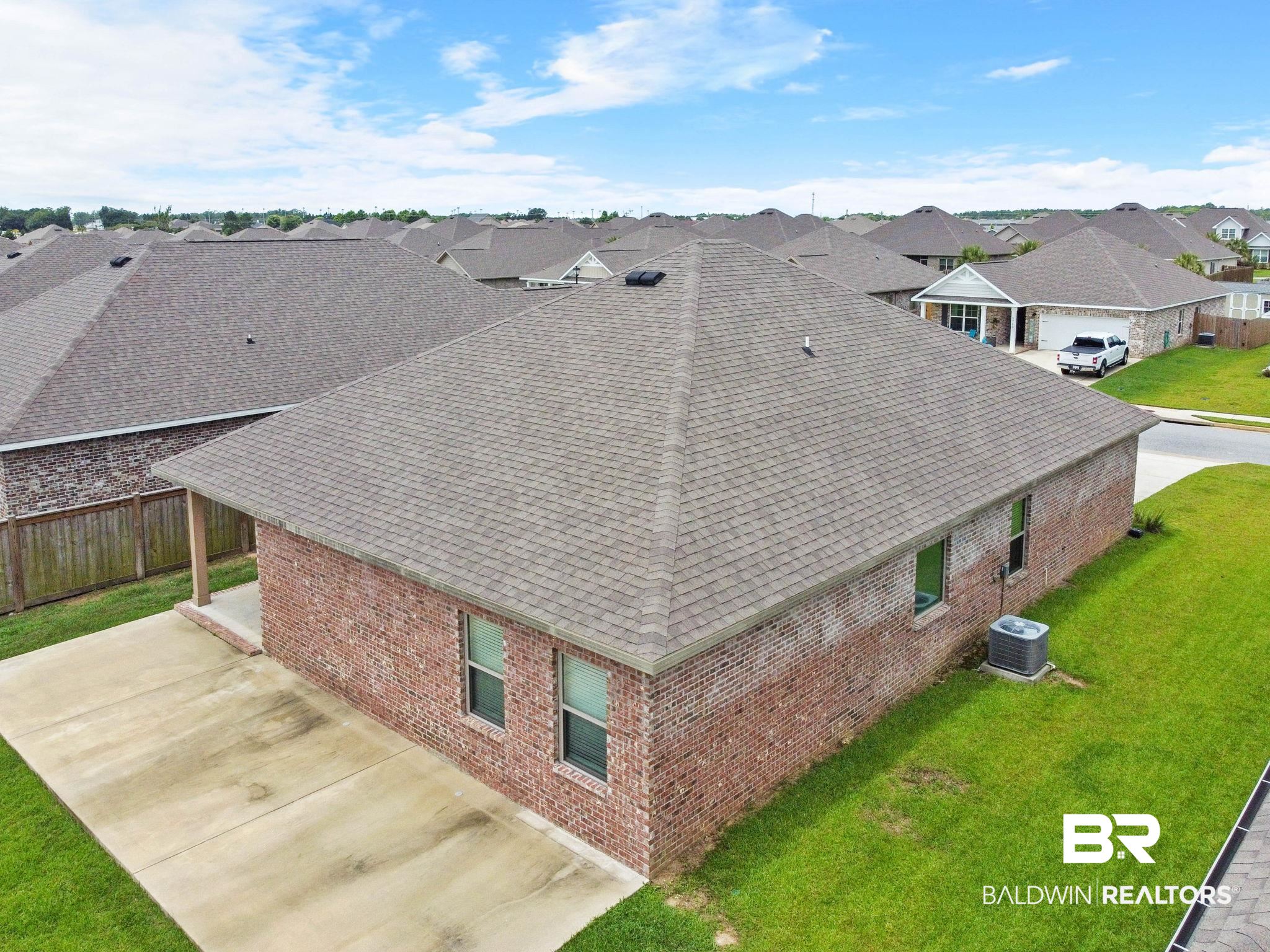 1710 Grouse Street Foley, AL 36535 - Photo 75 of 76 Brick exterior residence with a hip roof and asphalt shingles