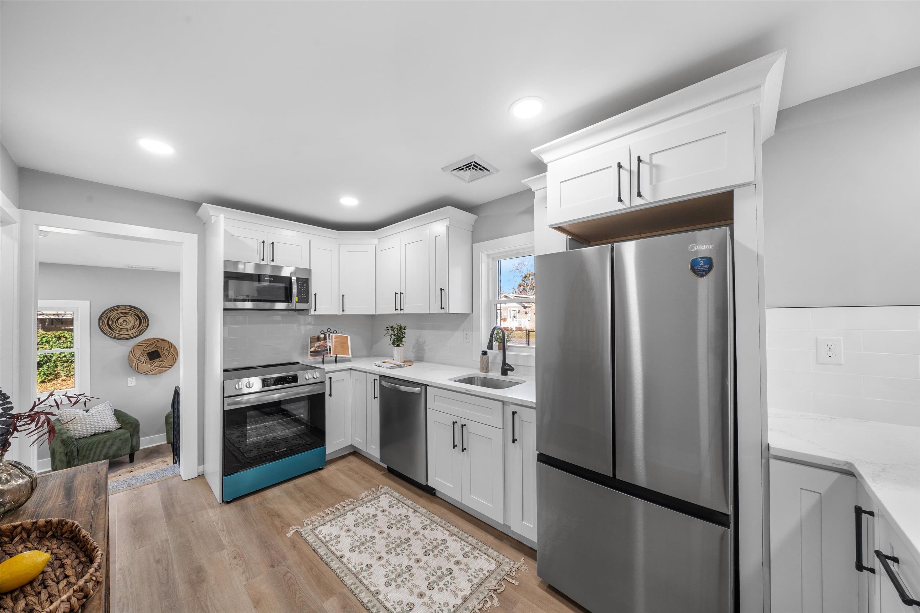 7 Tulip Avenue Villas, NJ 08251 - Photo 6 of 26 a kitchen with stainless steel appliances granite countertop a refrigerator a stove and a sink