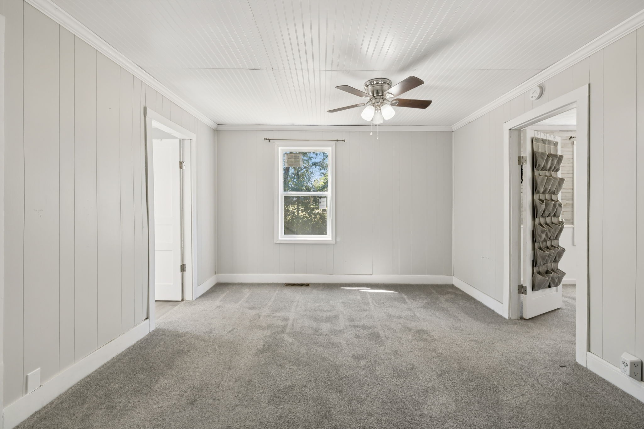 315 Ferguson Hill Road Lafayette, TN 37083 - Photo 12 of 29 an empty room with windows and fan