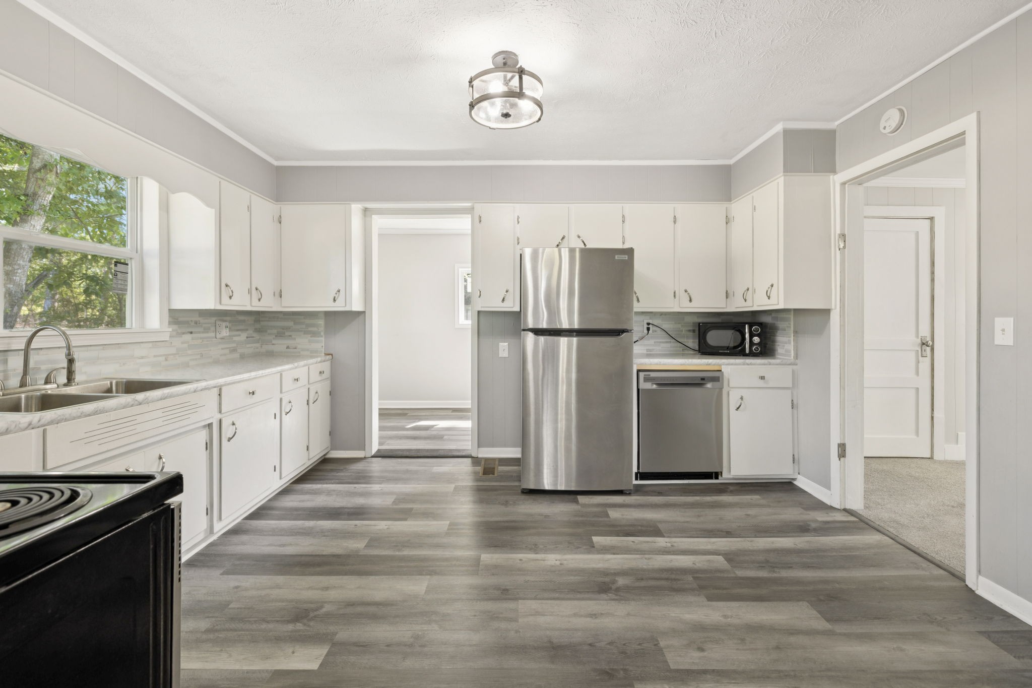 315 Ferguson Hill Road Lafayette, TN 37083 - Photo 15 of 29 a kitchen with white cabinets and white appliances