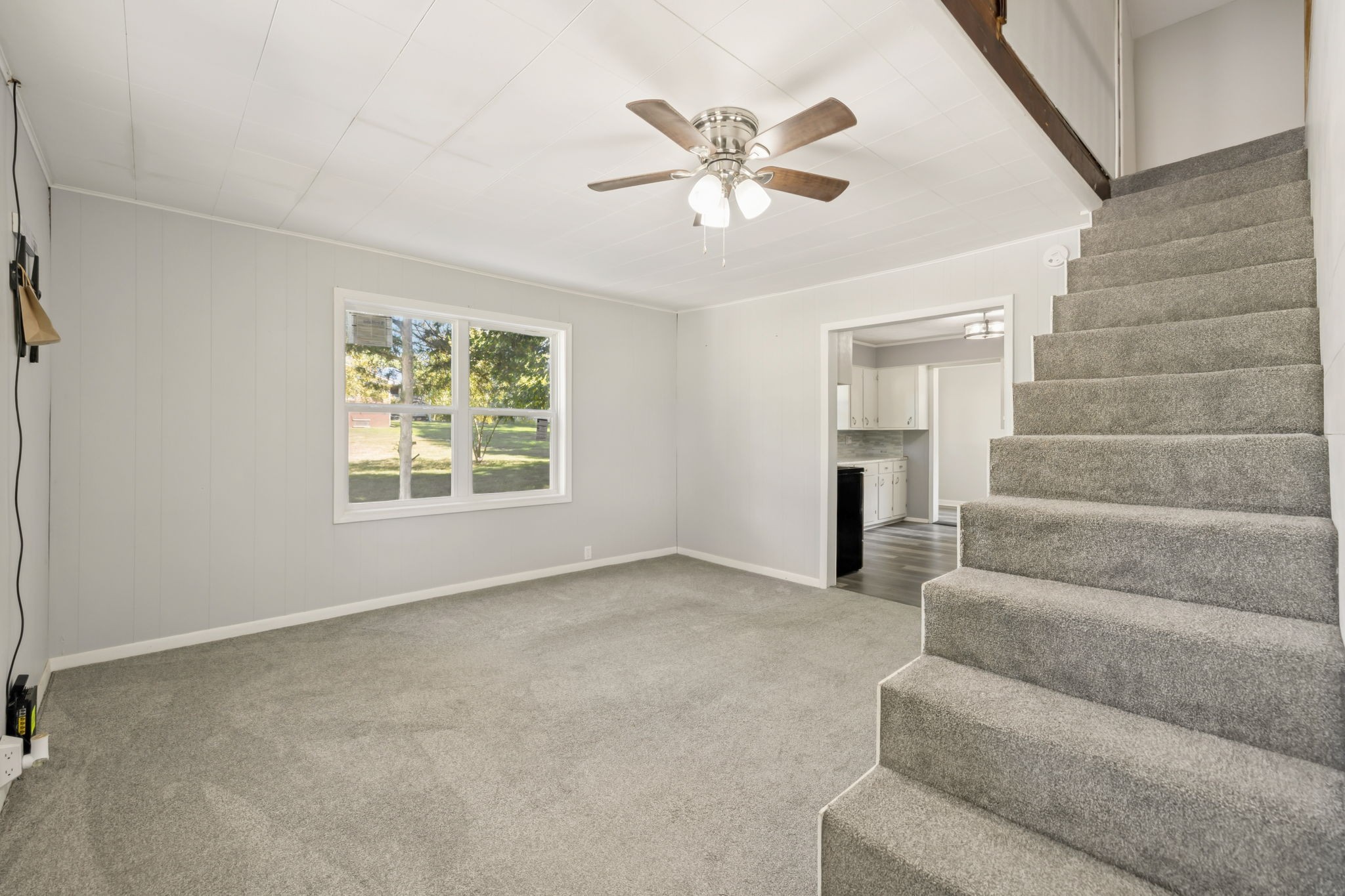 315 Ferguson Hill Road Lafayette, TN 37083 - Photo 2 of 29 a view of an empty room with stairs and a chandelier fan