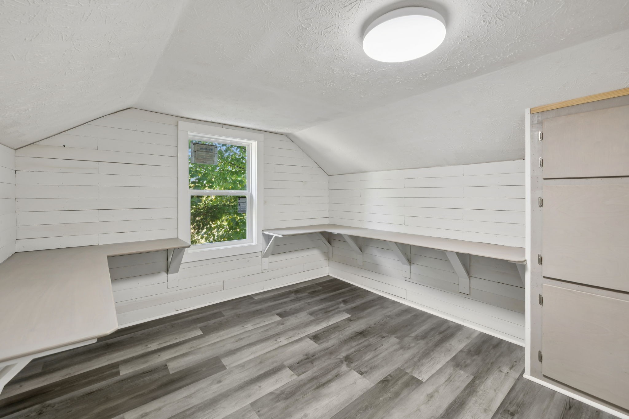 315 Ferguson Hill Road Lafayette, TN 37083 - Photo 21 of 29 a view of an empty room with a window and wooden floor