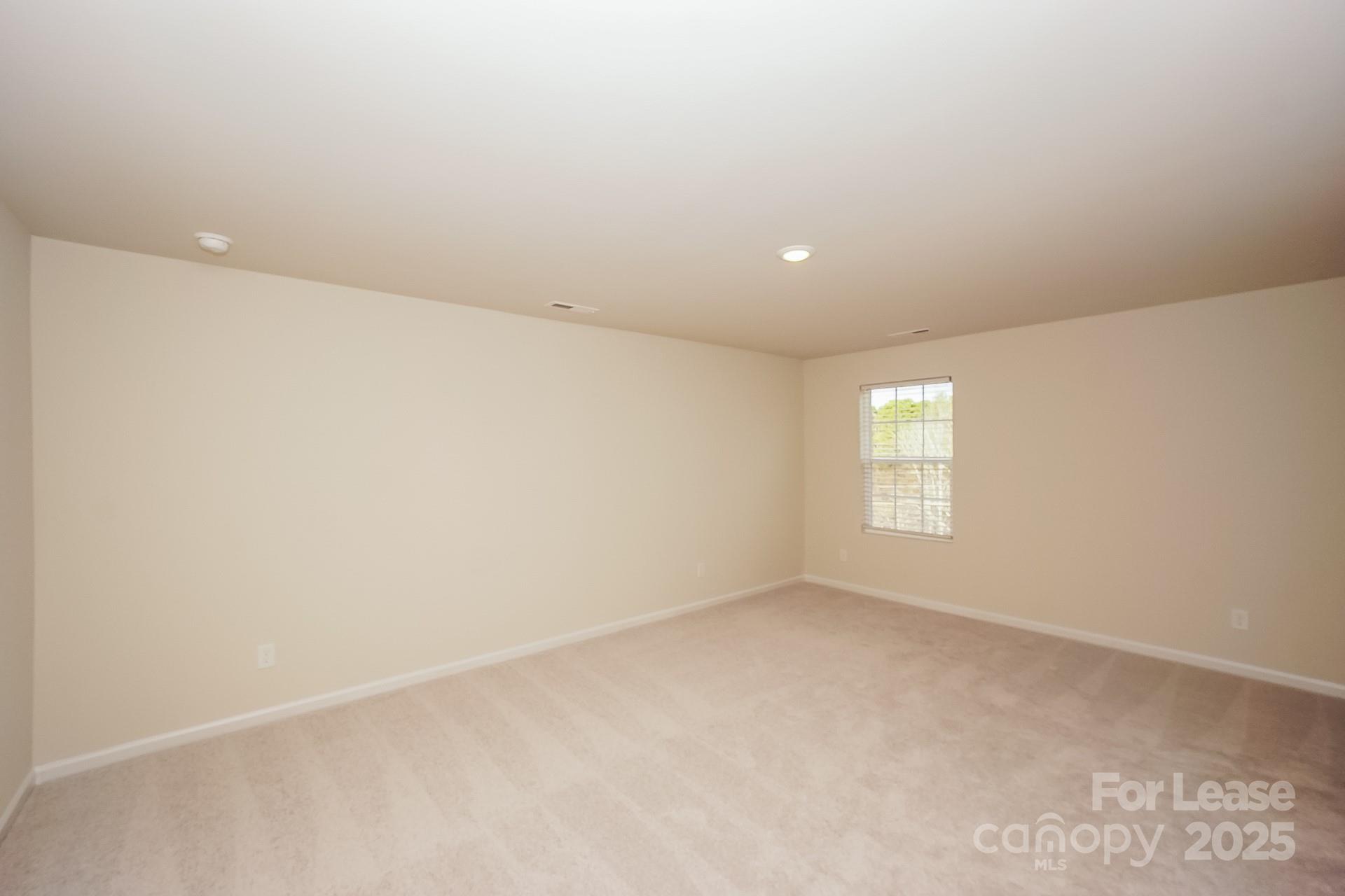 143 Arden Court Troutman, NC 28166 - Photo 12 of 18 an empty room with a window