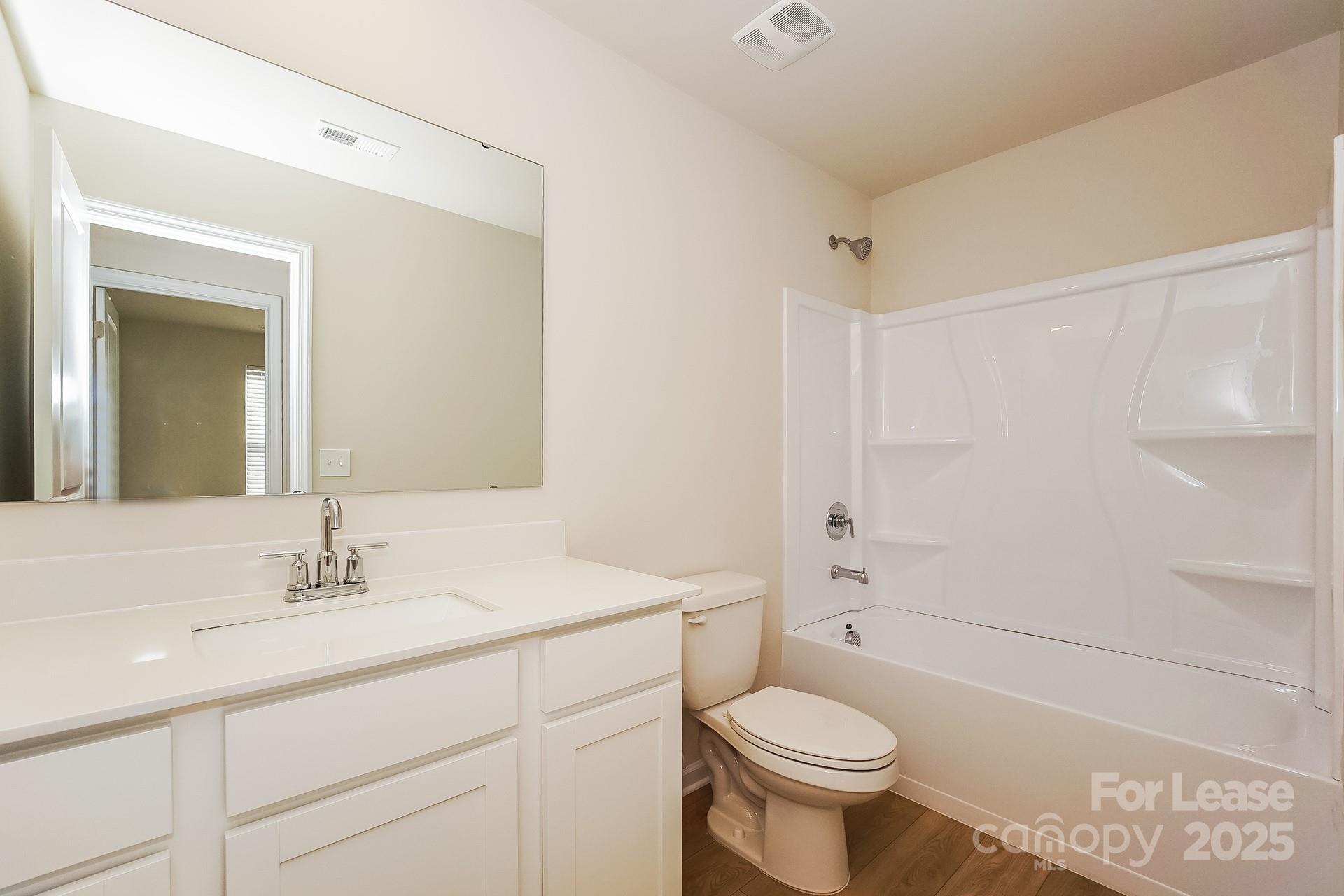 143 Arden Court Troutman, NC 28166 - Photo 15 of 18 a bathroom with a sink a toilet and shower