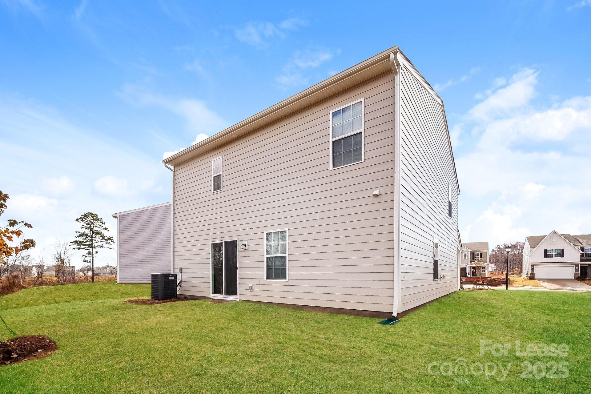 143 Arden Court Troutman, NC 28166 - Photo 16 of 18 a view of a house with a backyard
